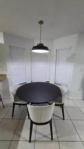 a table and a chair in a room