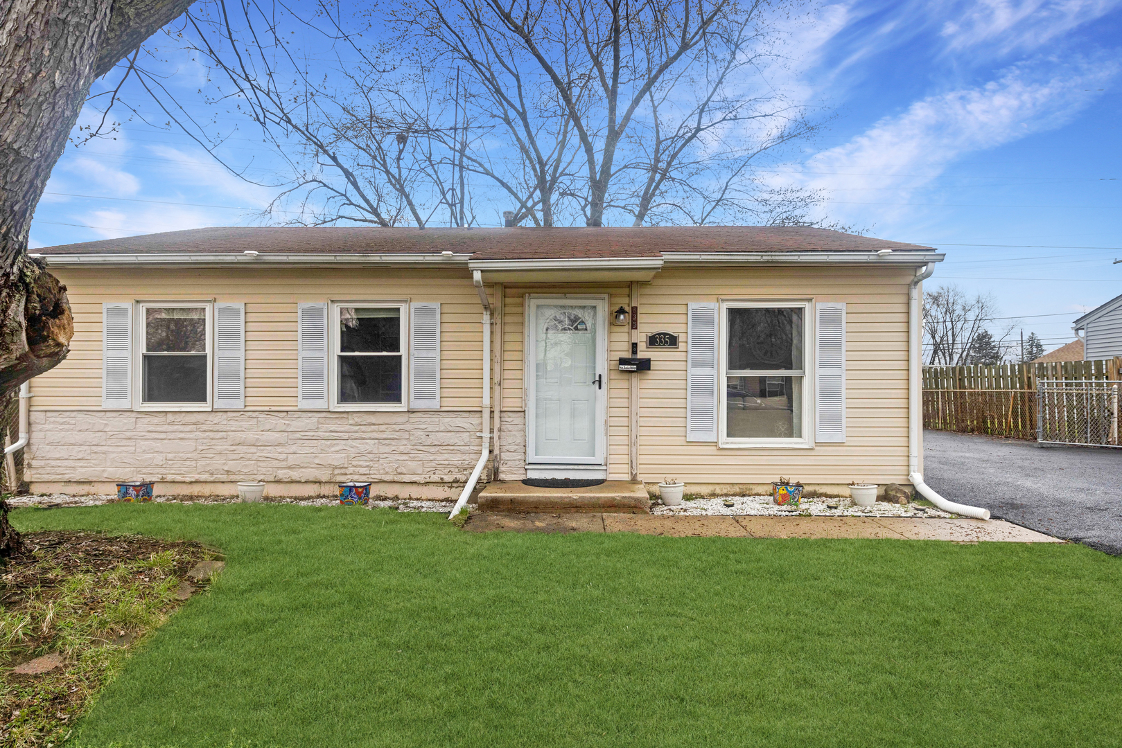 335 Macon Avenue Romeoville, IL 60446 - Photo 1 of 19 a front view of a house with a yard