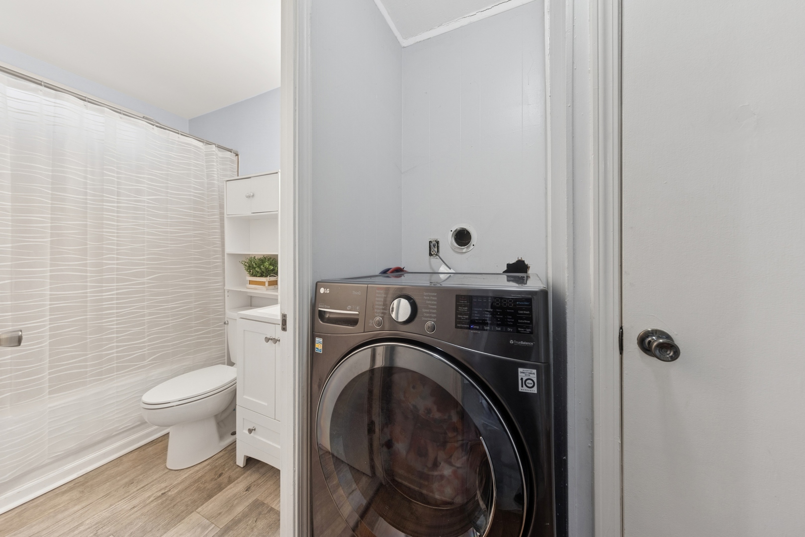 335 Macon Avenue Romeoville, IL 60446 - Photo 15 of 19 a view of a bathroom with a washer and dryer