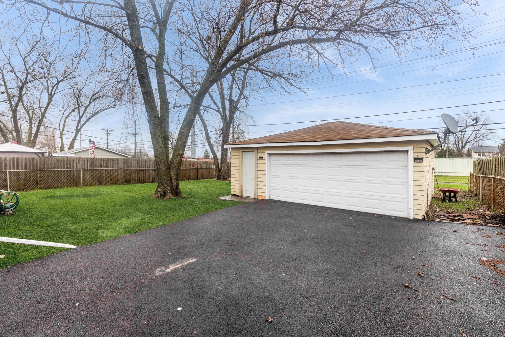 335 Macon Avenue Romeoville, IL 60446 - Photo 16 of 19 a view of a house with a yard and garage