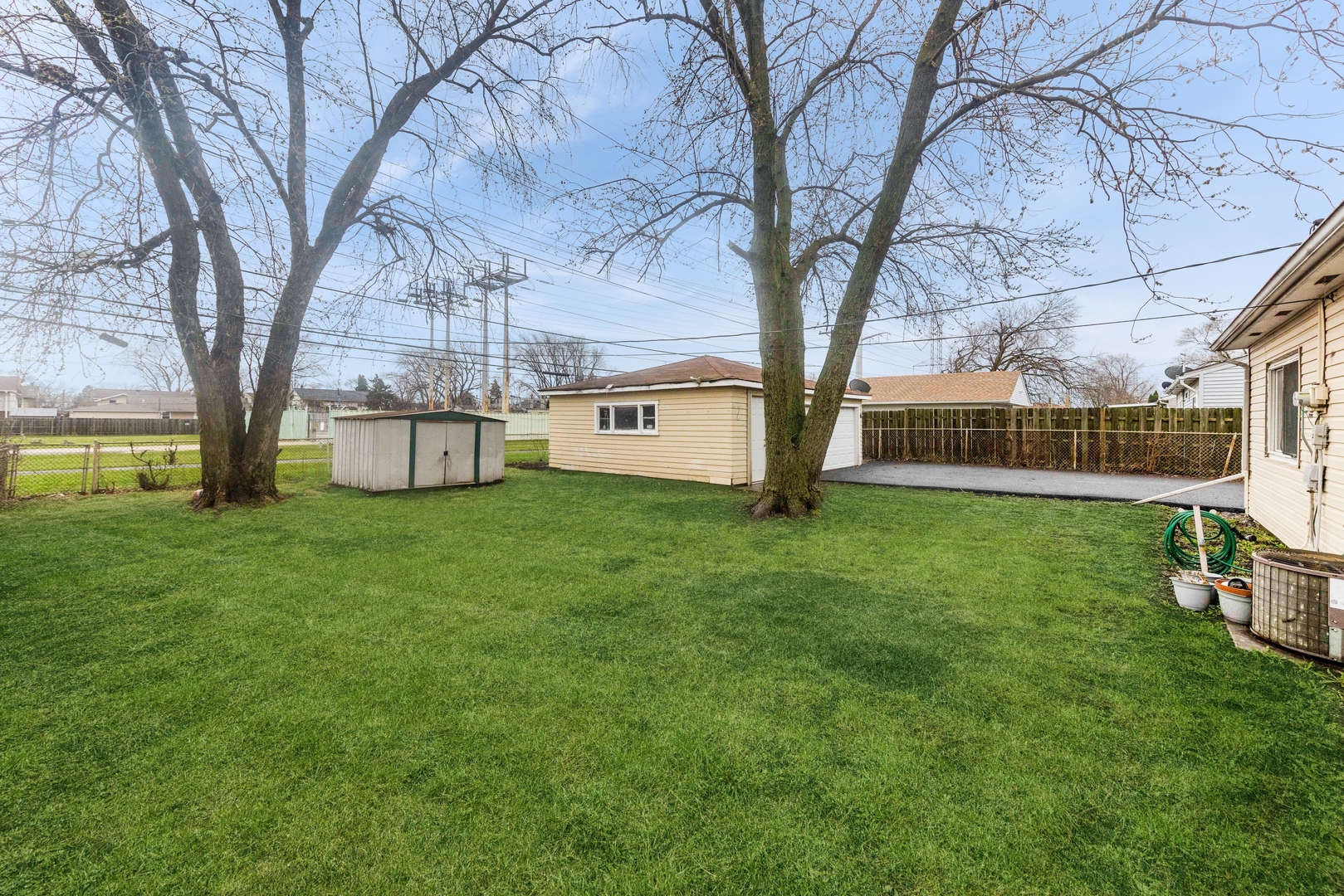 335 Macon Avenue Romeoville, IL 60446 - Photo 17 of 19 a view of a house with backyard and a tree