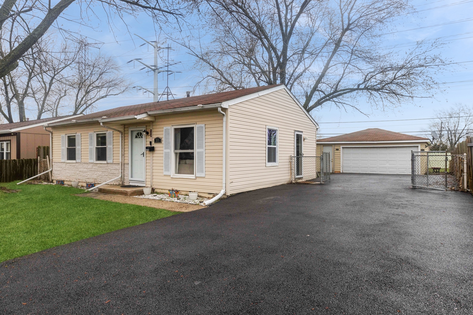 335 Macon Avenue Romeoville, IL 60446 - Photo 2 of 19 a view of a yard in front of a house