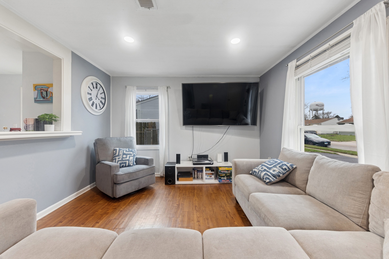 335 Macon Avenue Romeoville, IL 60446 - Photo 3 of 19 a living room with furniture and a flat screen tv