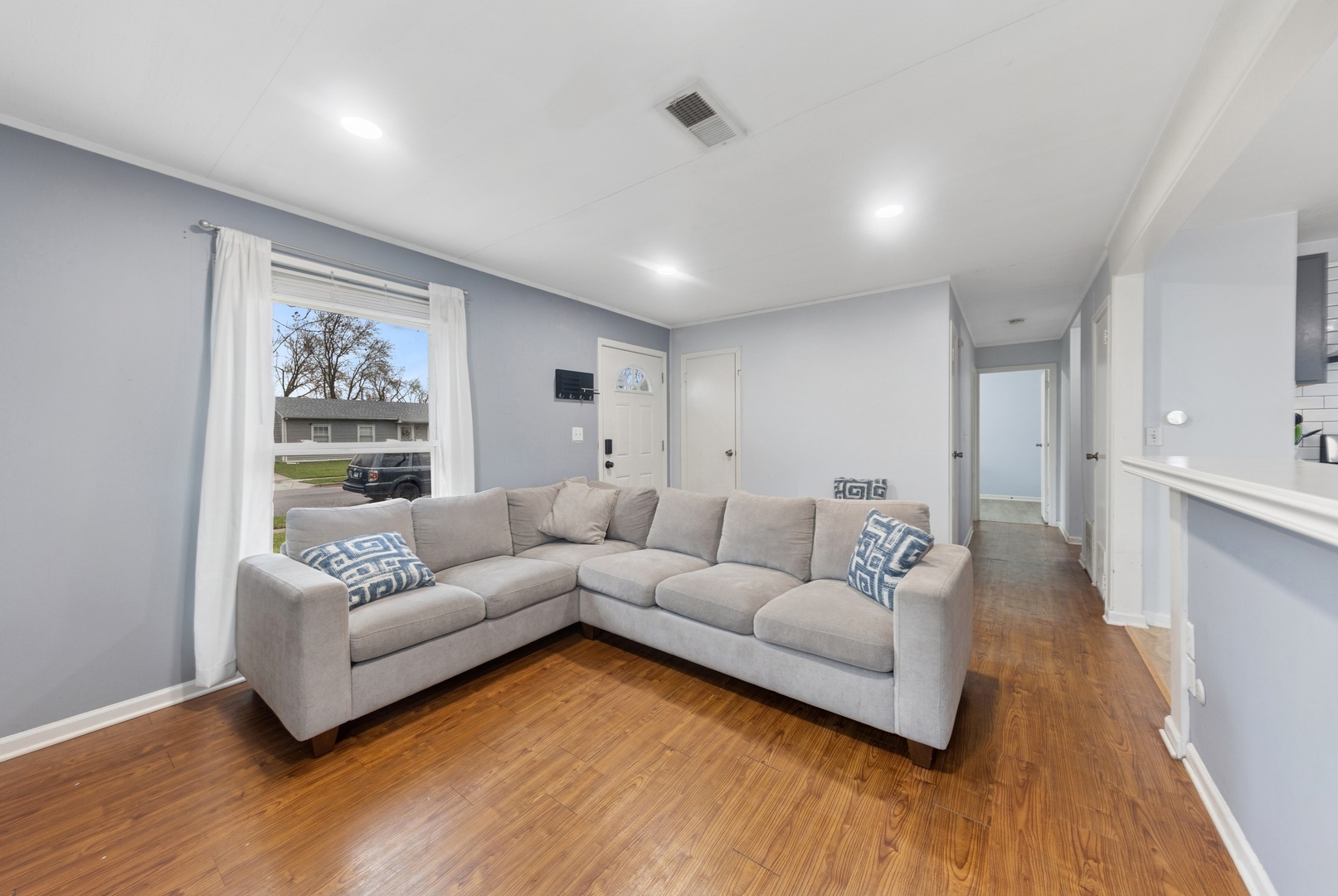 335 Macon Avenue Romeoville, IL 60446 - Photo 5 of 19 a living room with furniture and a wooden floor