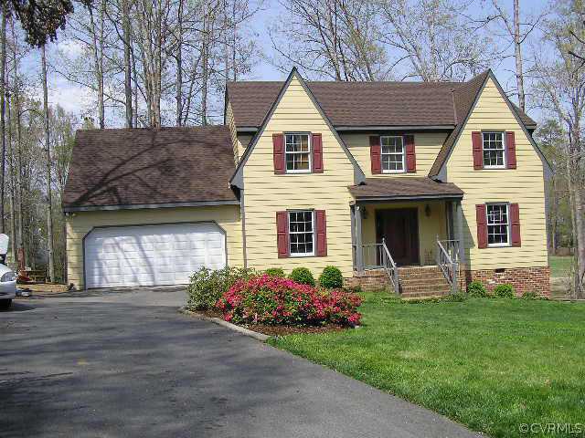 13802 Sterlings Bridge Road Midlothian, VA 23112 - Photo 1 of 1 a front view of a house with garden