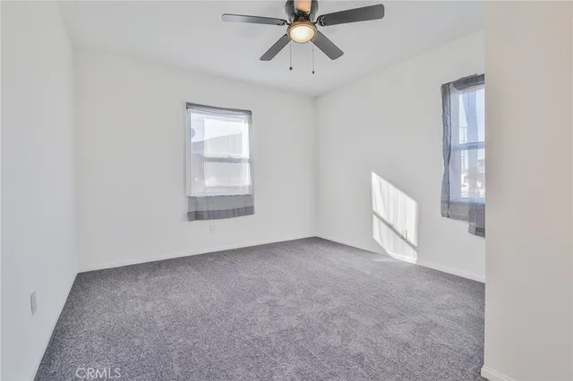 a white toilet sitting next to a bath tub