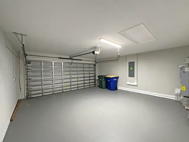 an empty room with furniture and natural light