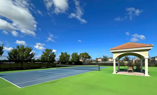 a view of a backyard with sitting area