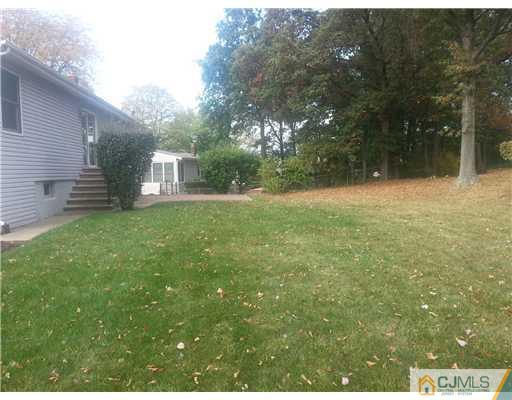 46 Harmon Road Edison, NJ 08837 - Photo 4 of 17 a view of a backyard of the house