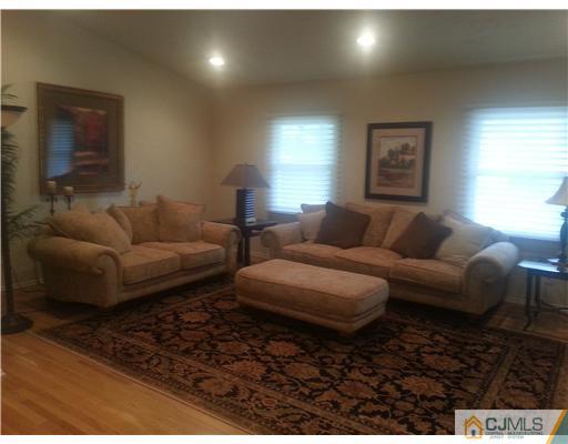 46 Harmon Road Edison, NJ 08837 - Photo 5 of 17 a living room with furniture and a window