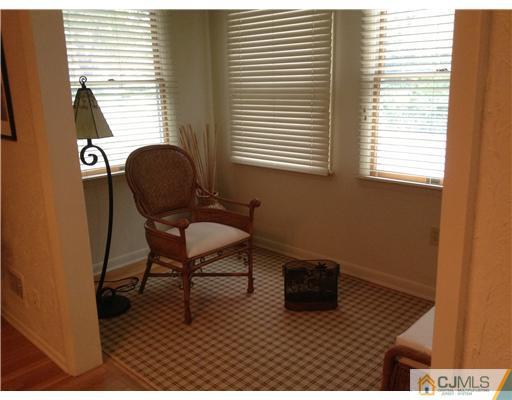 46 Harmon Road Edison, NJ 08837 - Photo 8 of 17 a workspace with furniture and a window