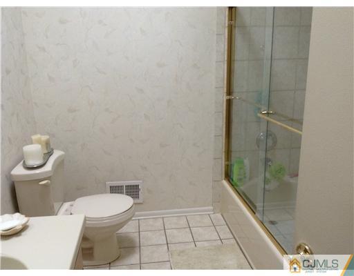 46 Harmon Road Edison, NJ 08837 - Photo 10 of 17 a bathroom with a toilet and a shower