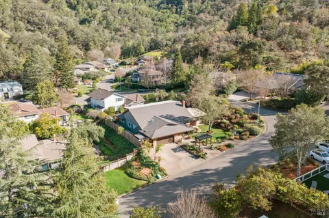 a view of a porch with furniture and floor to ceiling window