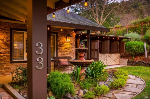a view of a chairs and table in the back yard