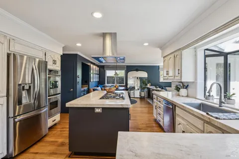 a work room with furniture and a flat screen tv