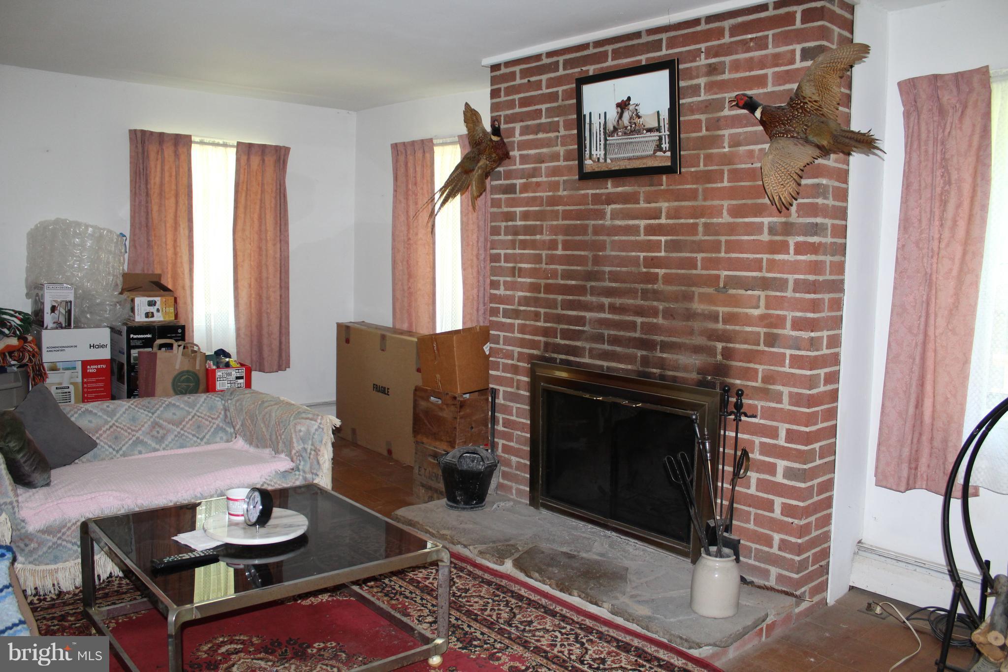 3359 Poplar Run Road Manchester, MD 21102 - Photo 12 of 30 a living room with furniture and a fireplace