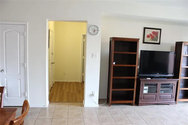 a view of a livingroom with furniture and a flat screen tv