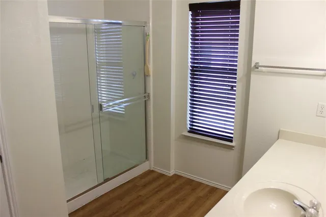 a view of a hallway with windows