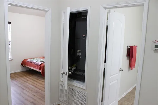 a view of a bedroom from a hallway