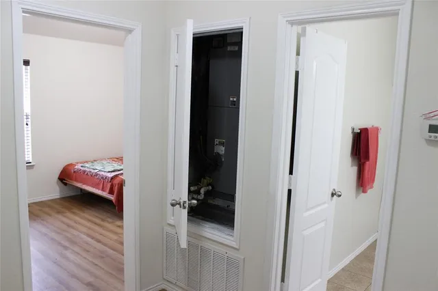 a view of a bedroom from a hallway