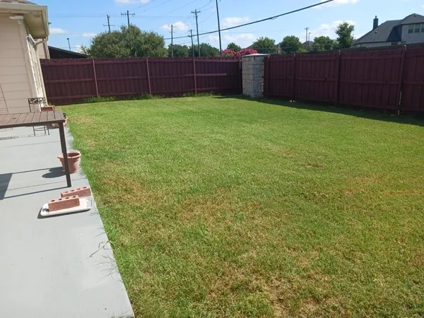 a backyard of a house with lots of green space