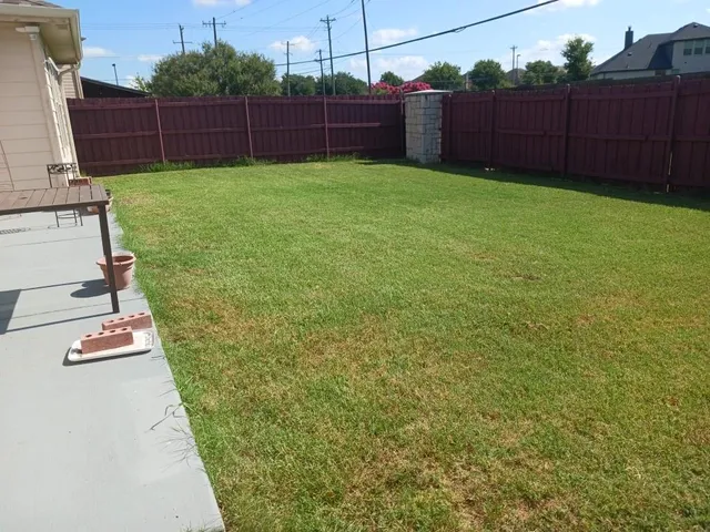 a backyard of a house with lots of green space