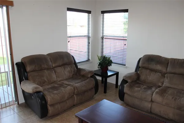 a living room with furniture and a window