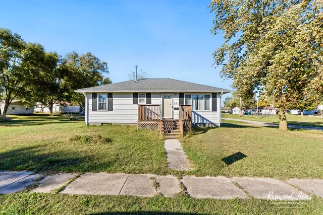 a view of a house with backyard porch and sitting area