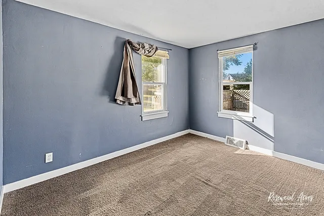 an empty room with windows