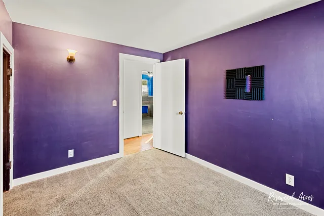 a view of a livingroom with an empty space and a window