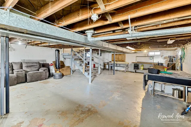 a view of a garage with wooden floors