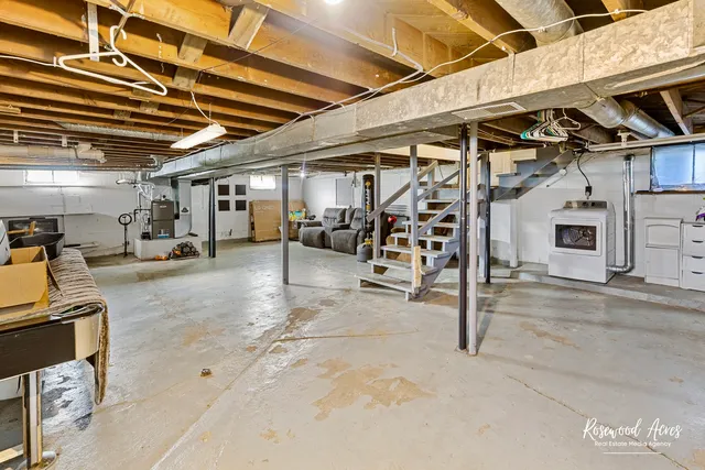 an entryway with wooden floor and cabinet