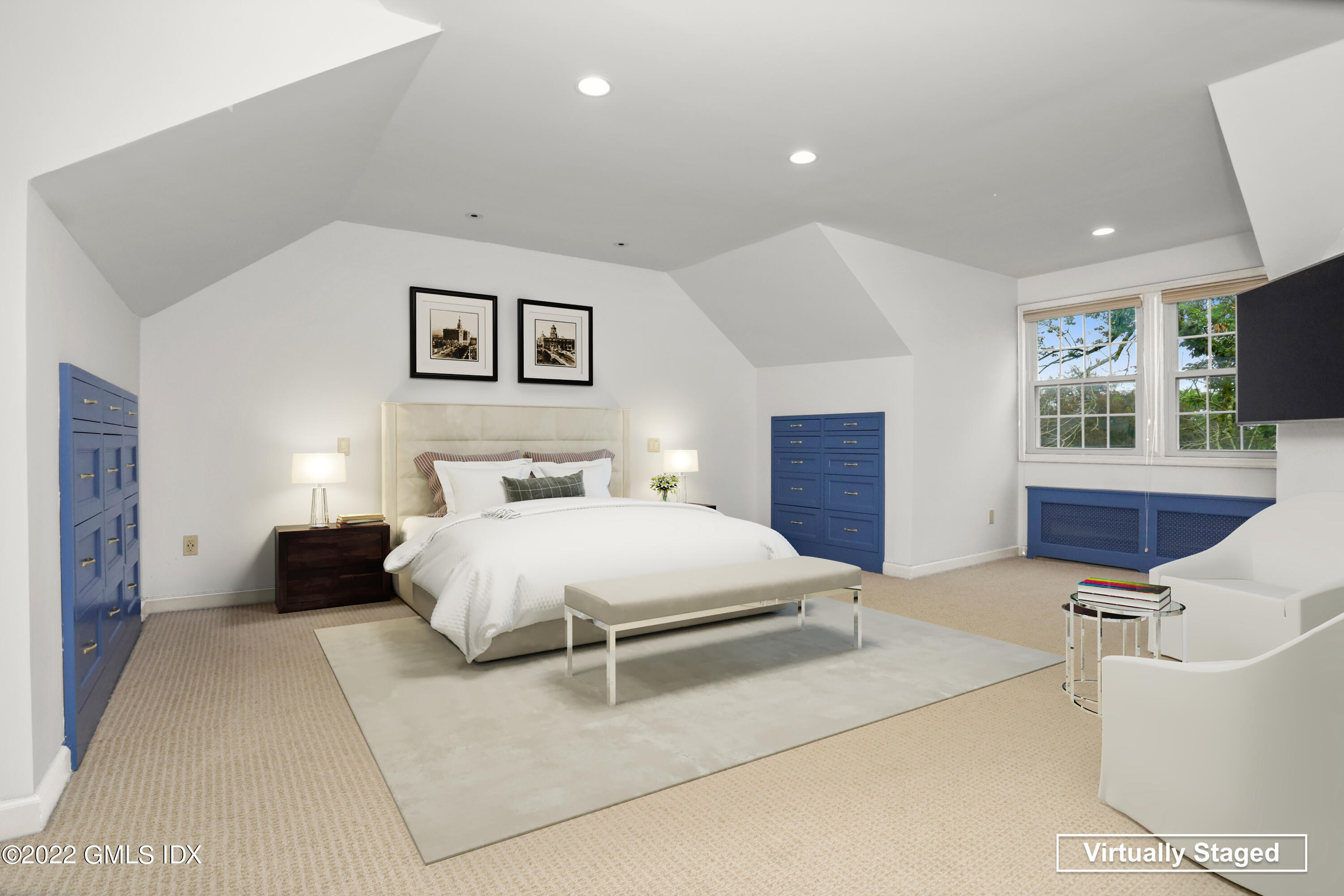 80 Putnam Park Greenwich, CT 06830 - Photo 10 of 20 a bedroom with a bed and wooden floor