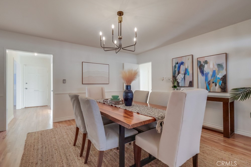 3562 North Studebaker Road Long Beach, CA 90808 - Photo 16 of 39 a view of a dining room with furniture and a chandelier