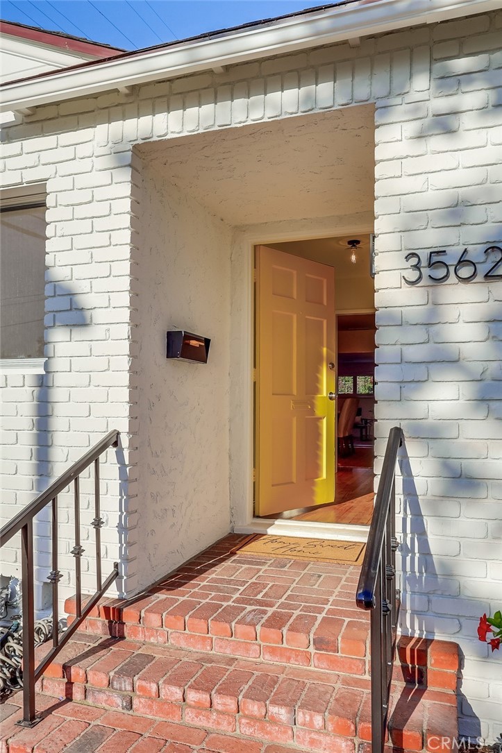 3562 North Studebaker Road Long Beach, CA 90808 - Photo 2 of 39 a view of a hallway with a dining room