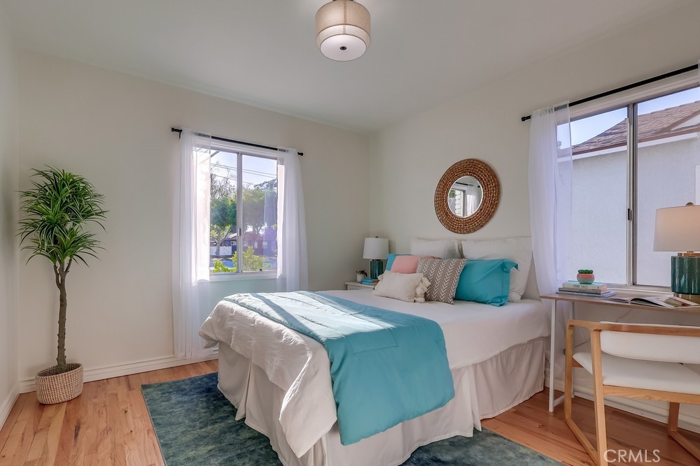 3562 North Studebaker Road Long Beach, CA 90808 - Photo 24 of 39 a bedroom with a bed and a potted plant