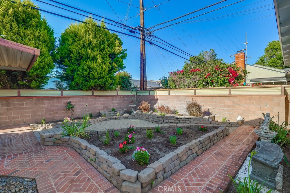 3562 North Studebaker Road Long Beach, CA 90808 - Photo 37 of 39 a bunch of flowers in front of a house