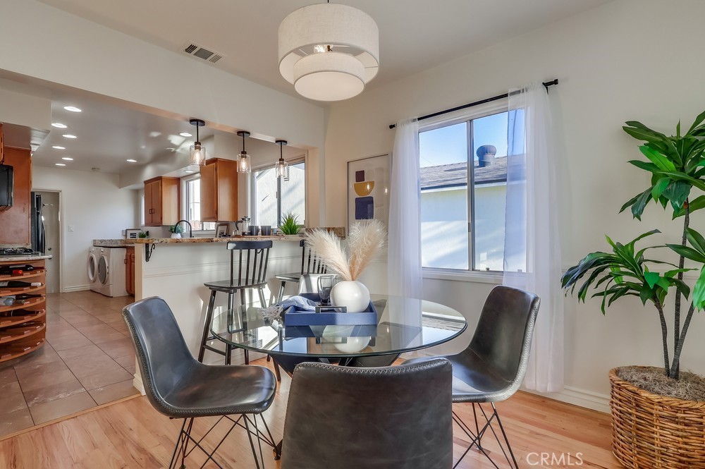 3562 North Studebaker Road Long Beach, CA 90808 - Photo 6 of 39 a view of a dining room with furniture window and wooden floor