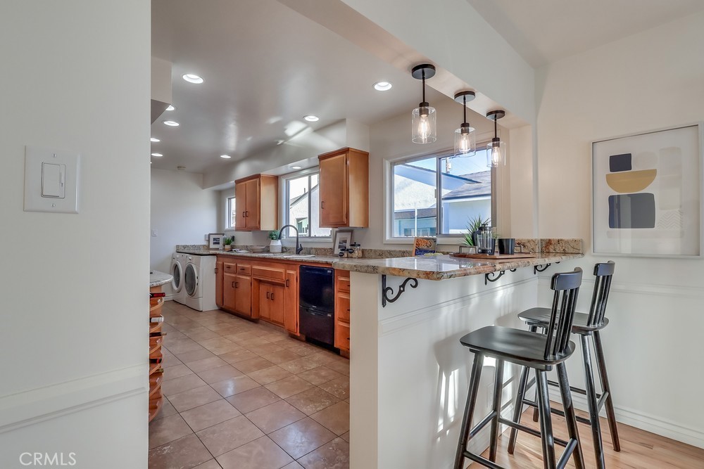 3562 North Studebaker Road Long Beach, CA 90808 - Photo 7 of 39 a large kitchen with a table and chairs