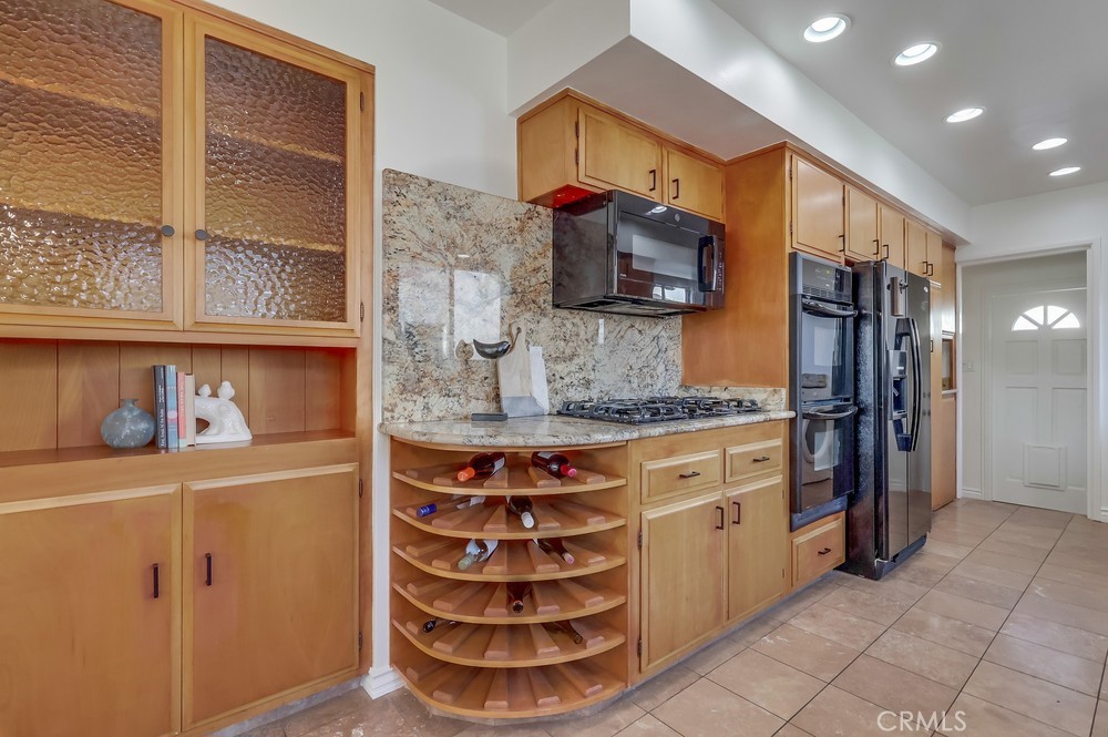 3562 North Studebaker Road Long Beach, CA 90808 - Photo 9 of 39 a kitchen with stainless steel appliances cabinets and a counter top space