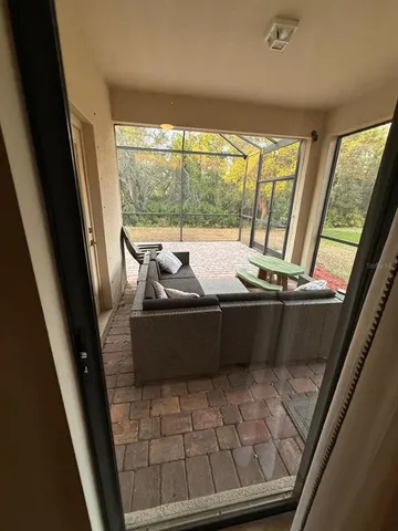 an aerial view of residential houses with outdoor space and swimming pool