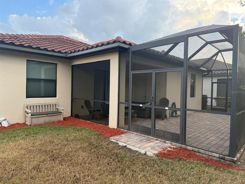12792 Richezza Drive Venice, FL 34293 - Photo 19 of 24 a view of a patio with a table and chairs