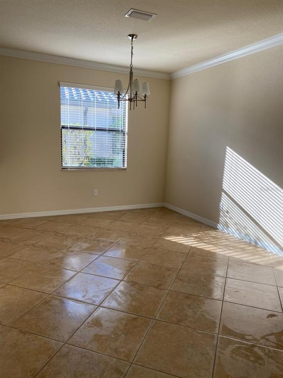 12792 Richezza Drive Venice, FL 34293 - Photo 10 of 24 a view of a room with an empty space and a window