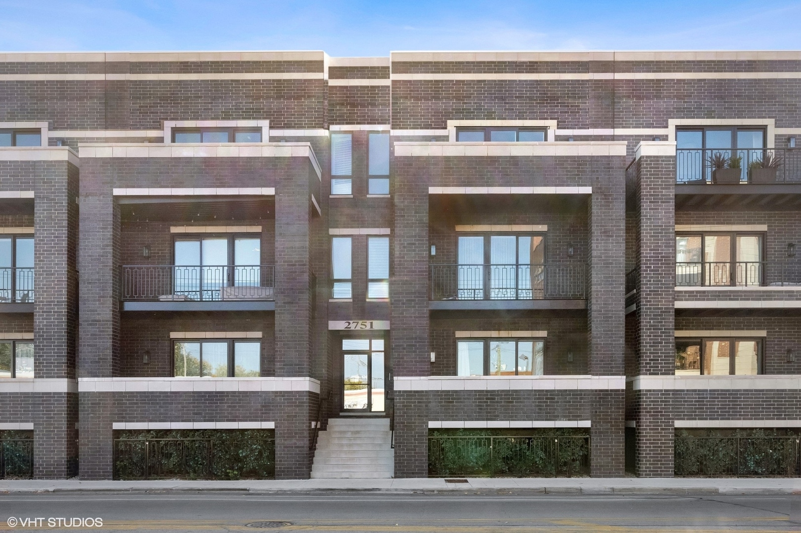 2751 West Lawrence Avenue, Unit 3W Chicago, IL 60625 - Photo 1 of 21 a front view of a building with a lot of windows