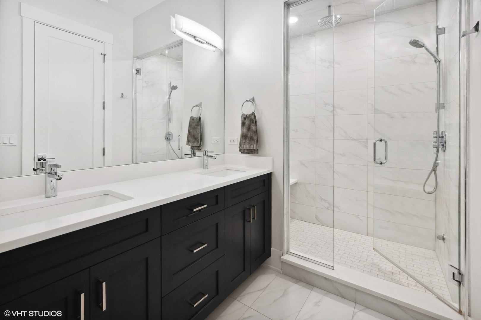2751 West Lawrence Avenue, Unit 3W Chicago, IL 60625 - Photo 11 of 21 a bathroom with a shower sink vanity and mirror