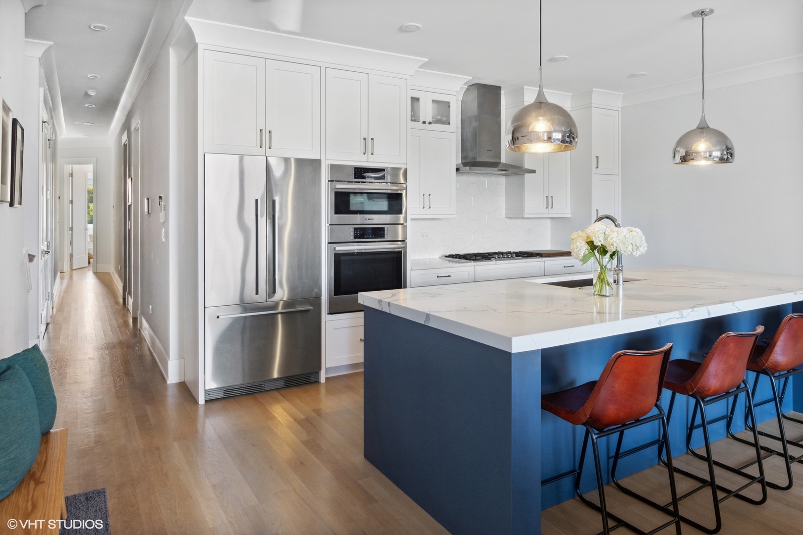 2751 West Lawrence Avenue, Unit 3W Chicago, IL 60625 - Photo 3 of 21 a kitchen with stainless steel appliances a dining table chairs and refrigerator