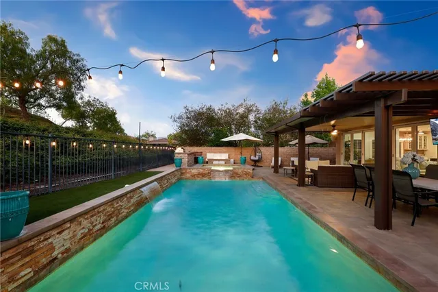 a view of a swimming pool with a patio