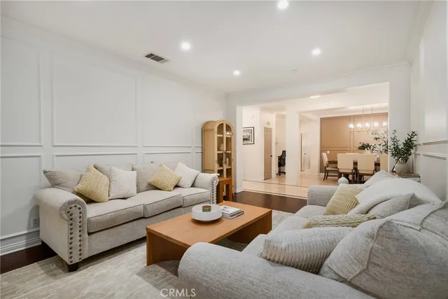 a view of a dining room with furniture and chandelier