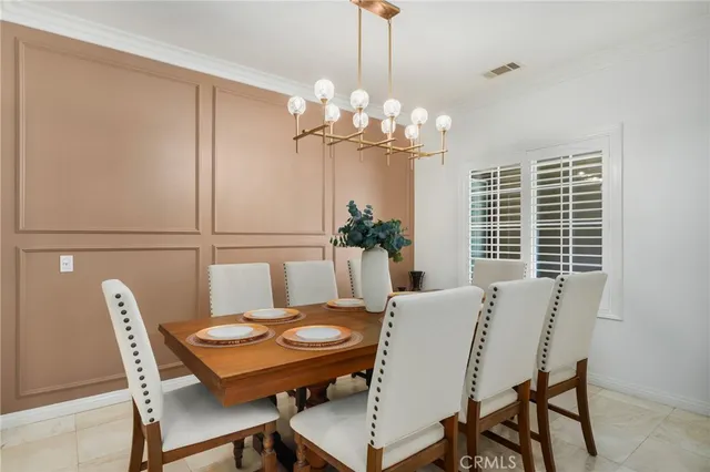 a bedroom with a bed and a lamp