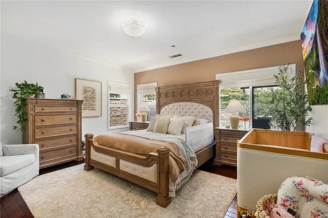 a bathroom with a granite countertop sink a toilet a mirror and shower